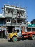 Truck in front of building construction